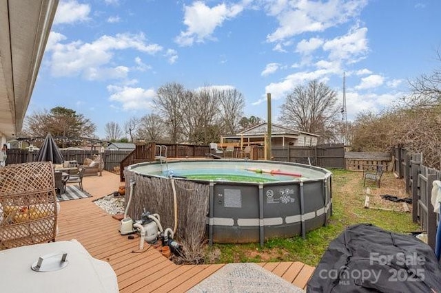 exterior space with a fenced backyard and a wooden deck