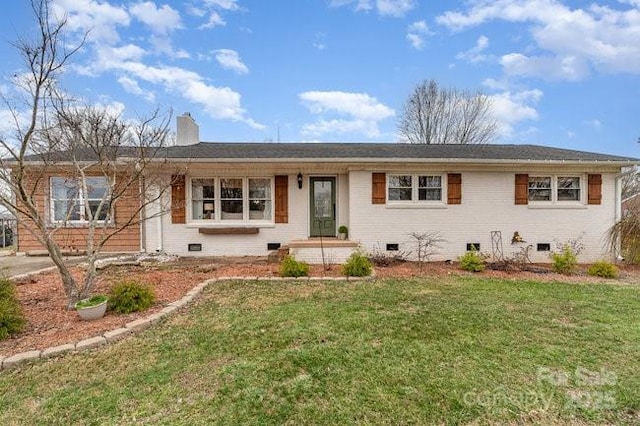 ranch-style house with a chimney, brick siding, crawl space, and a front yard