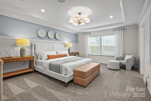 bedroom with a raised ceiling, an inviting chandelier, carpet, crown molding, and recessed lighting