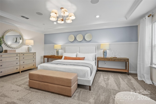 bedroom featuring carpet floors, visible vents, and an inviting chandelier