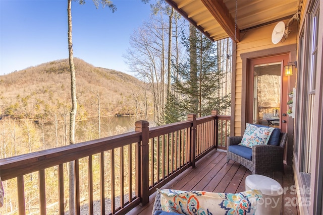 wooden deck with a mountain view