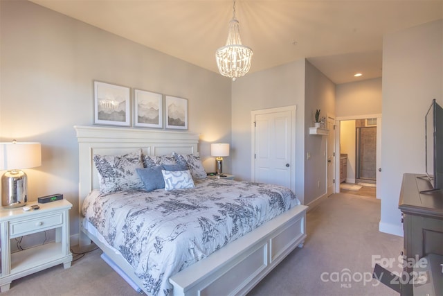 carpeted bedroom with an inviting chandelier and baseboards