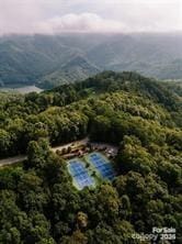 aerial view featuring a forest view