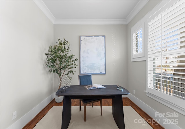 office with baseboards, wood finished floors, and ornamental molding