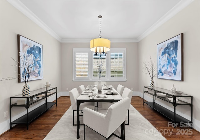 dining space featuring baseboards, dark wood-style floors, and crown molding