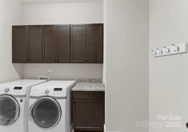 washroom with separate washer and dryer and cabinet space