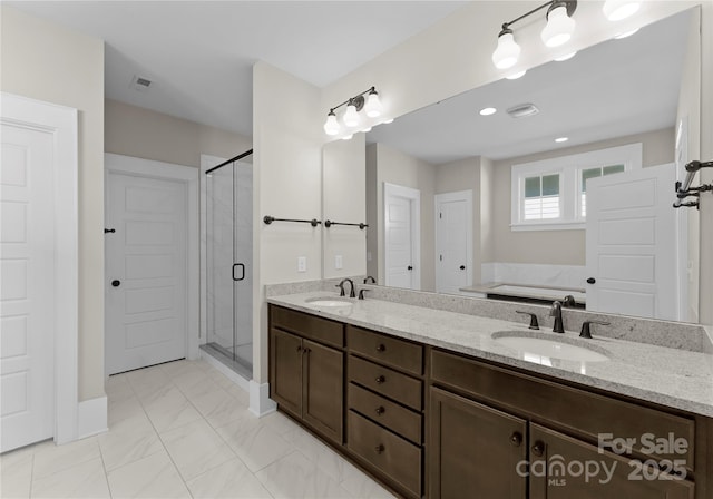 full bathroom with double vanity, visible vents, a shower stall, and a sink