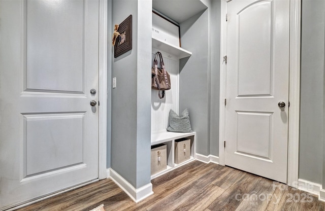 mudroom featuring baseboards and wood finished floors