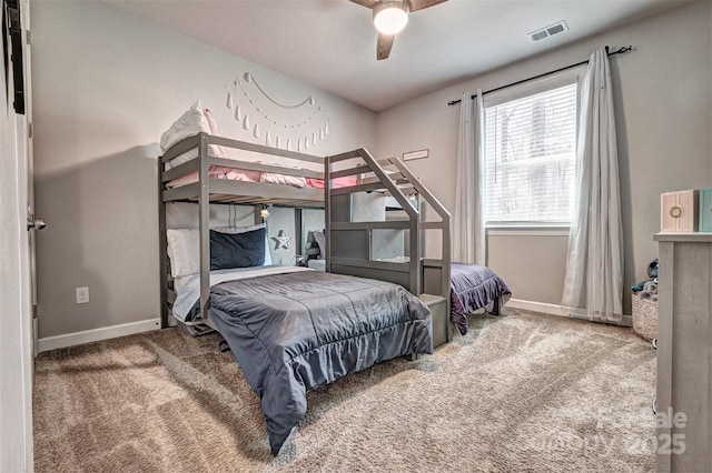 bedroom featuring carpet, visible vents, ceiling fan, and baseboards