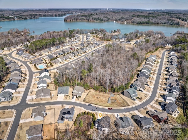 birds eye view of property with a water view and a residential view