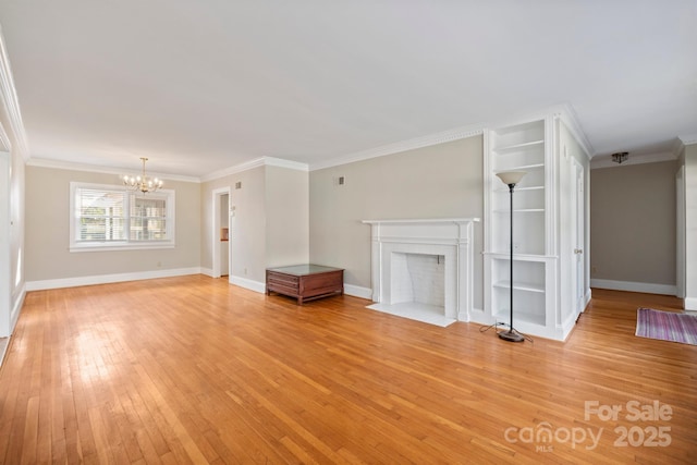 unfurnished living room with light wood finished floors, a fireplace with flush hearth, ornamental molding, a chandelier, and baseboards