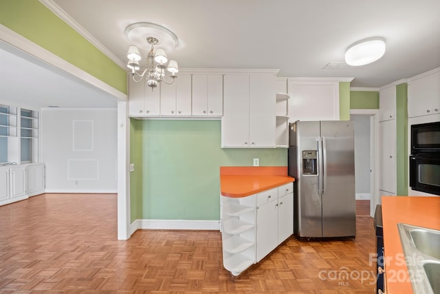 kitchen featuring stainless steel fridge, ornamental molding, white cabinets, and light countertops