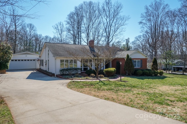 single story home with brick siding, a chimney, a garage, an outdoor structure, and a front lawn