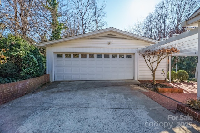 garage featuring driveway