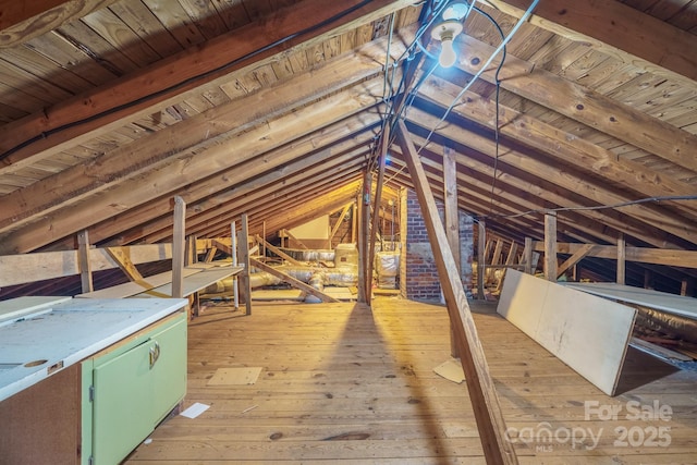 attic featuring an upstairs landing