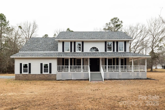 view of front of house featuring a porch, a front yard, and a shingled roof