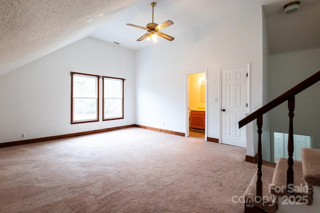 additional living space with baseboards, stairs, carpet flooring, a textured ceiling, and a ceiling fan