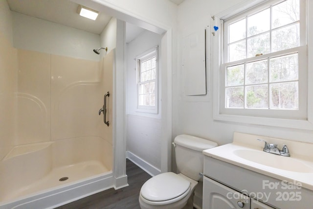 full bathroom with vanity, toilet, a shower, and wood finished floors