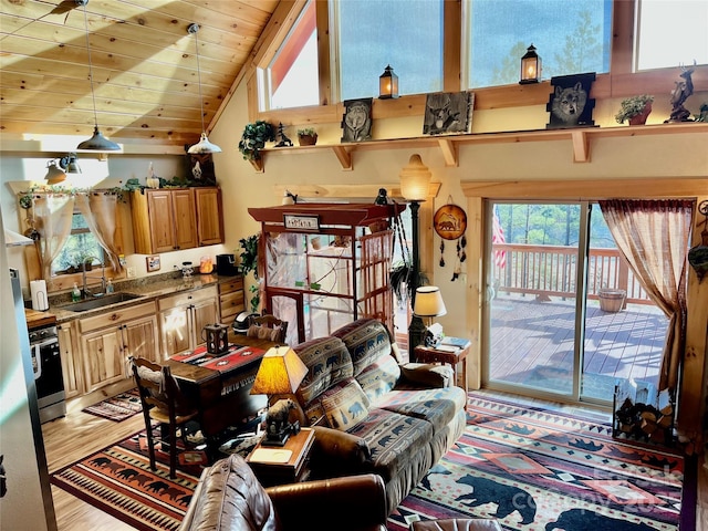 living room with light wood-type flooring, wooden ceiling, and vaulted ceiling