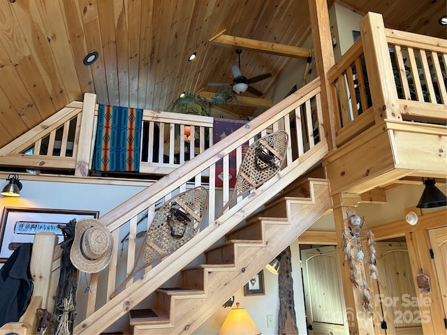 stairway featuring wood ceiling, high vaulted ceiling, and ceiling fan