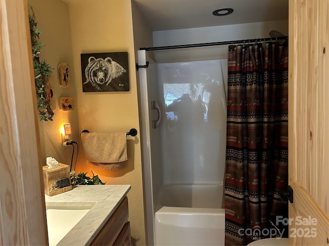 full bath featuring shower / tub combo with curtain and vanity