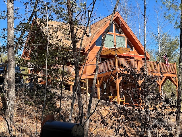 view of home's exterior with a deck