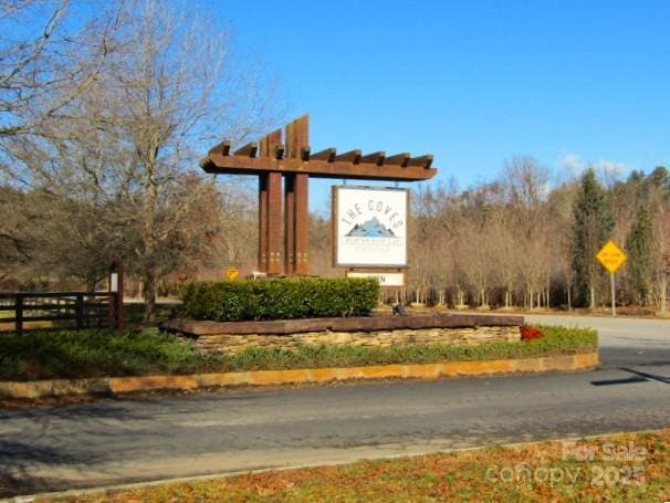 view of community featuring fence