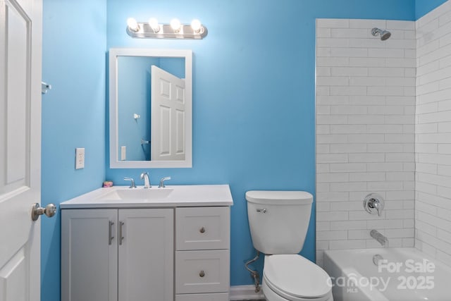 full bath with bathtub / shower combination, vanity, and toilet