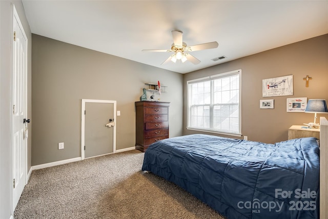 carpeted bedroom with a ceiling fan, visible vents, and baseboards