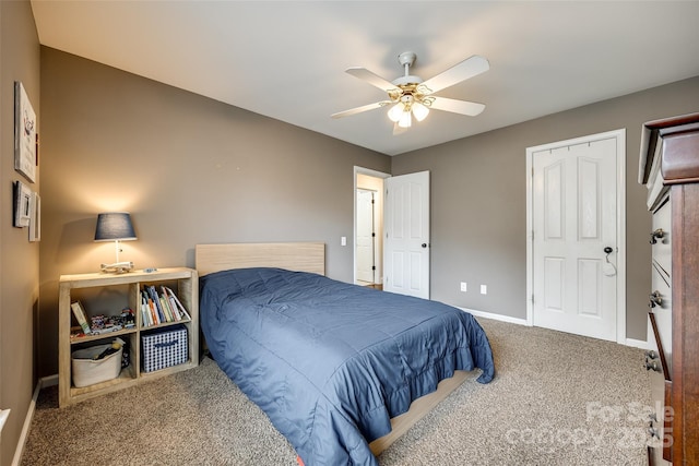 bedroom with carpet floors, baseboards, and a ceiling fan