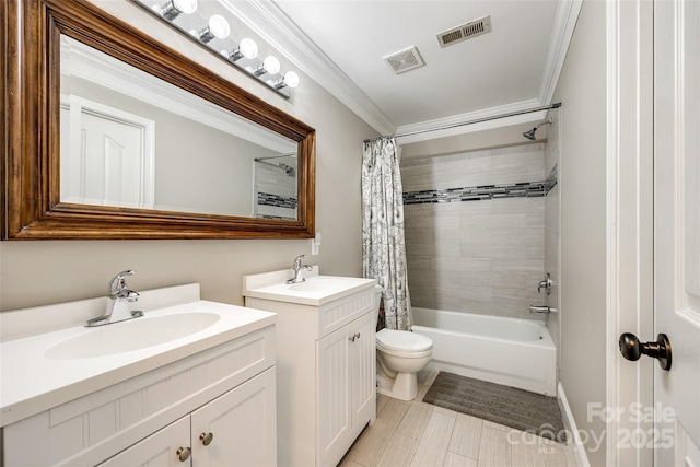 bathroom featuring a sink, visible vents, and crown molding