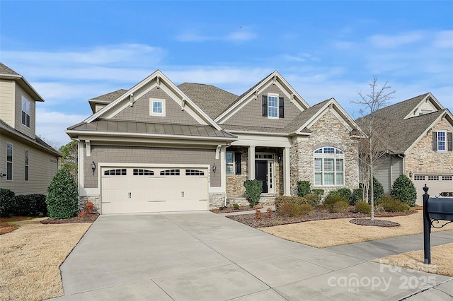 craftsman-style home featuring a standing seam roof, stone siding, driveway, and metal roof