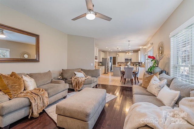 living room featuring light wood-style floors and ceiling fan