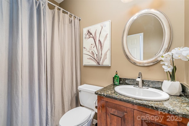 full bath with toilet and vanity