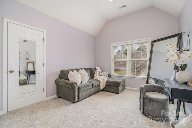 carpeted living area featuring lofted ceiling, visible vents, and baseboards