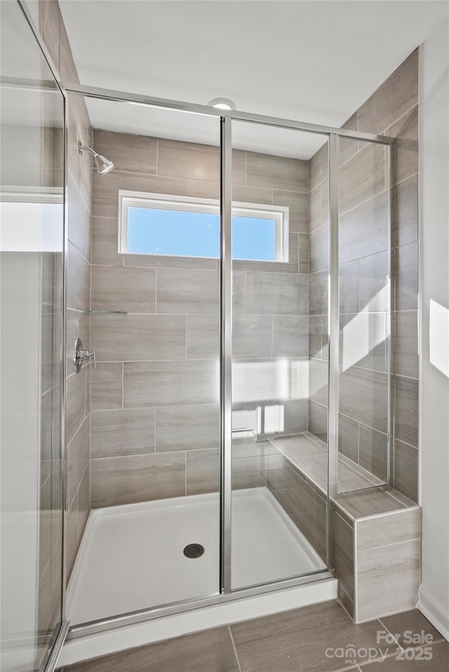 full bath featuring a shower stall