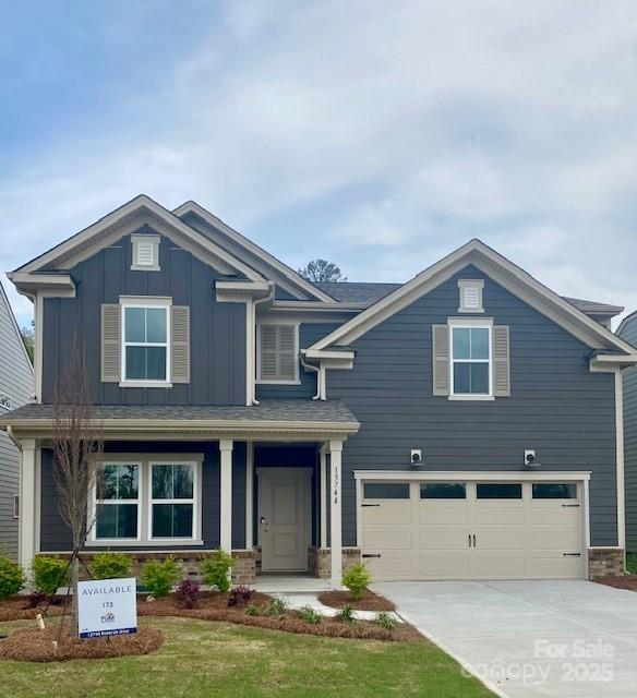 13744 Roderick Dr Unit 173, Huntersville, NC 28078 - craftsman-style home with board and batten siding, an attached garage, and concrete driveway