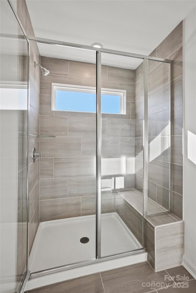 13744 Roderick Dr Unit 173, Huntersville, NC 28078 - bathroom with a stall shower and a wealth of natural light
