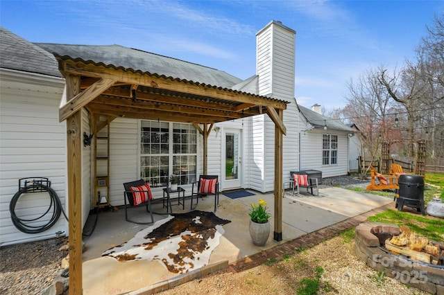 view of patio featuring a fire pit