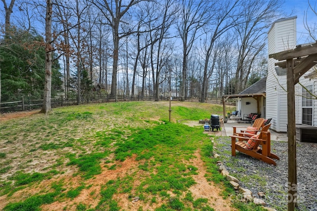 view of yard featuring a patio area and a fenced backyard