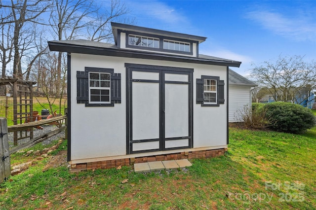 view of shed with fence