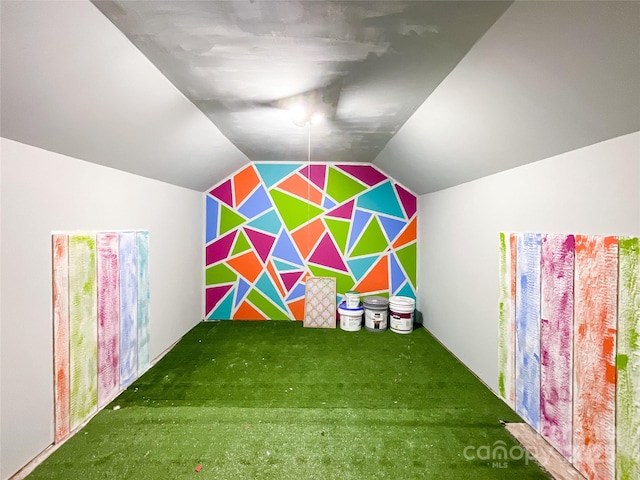 game room with carpet floors and vaulted ceiling