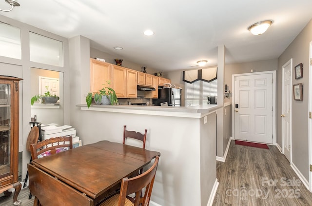 dining space with recessed lighting, dark wood finished floors, and baseboards