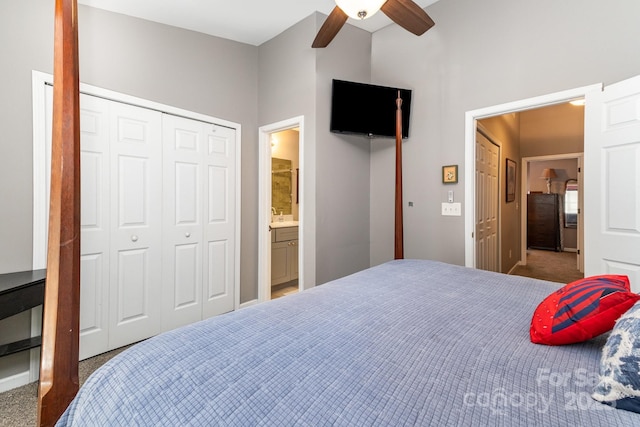 bedroom with ceiling fan, carpet floors, a closet, and connected bathroom