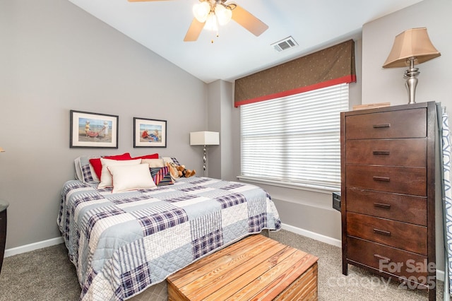 bedroom with visible vents, a ceiling fan, carpet flooring, vaulted ceiling, and baseboards