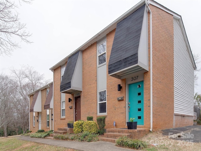 view of front of home with brick siding