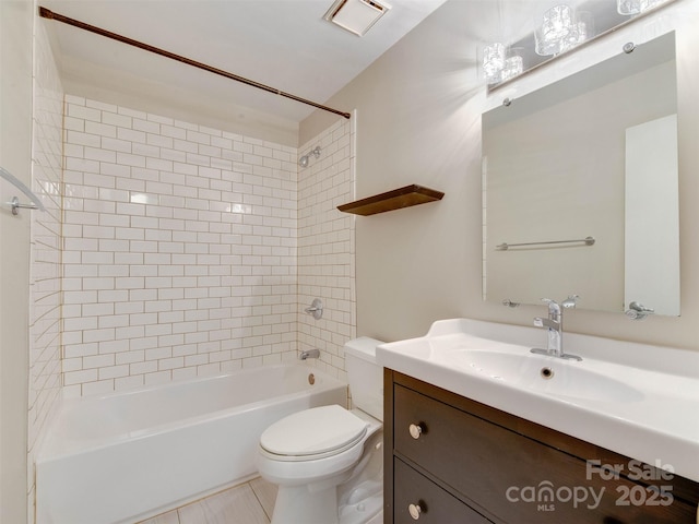 bathroom featuring toilet, visible vents, tub / shower combination, and vanity