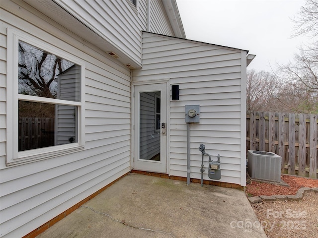 view of patio / terrace featuring cooling unit and fence