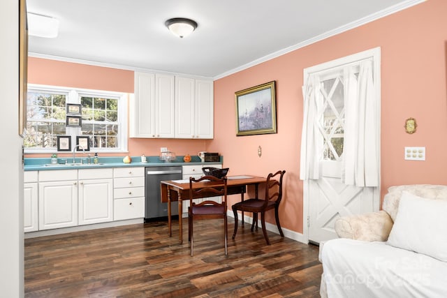 office with crown molding, dark wood-style flooring, a sink, and baseboards