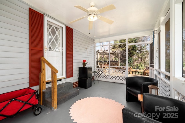 sunroom with a ceiling fan